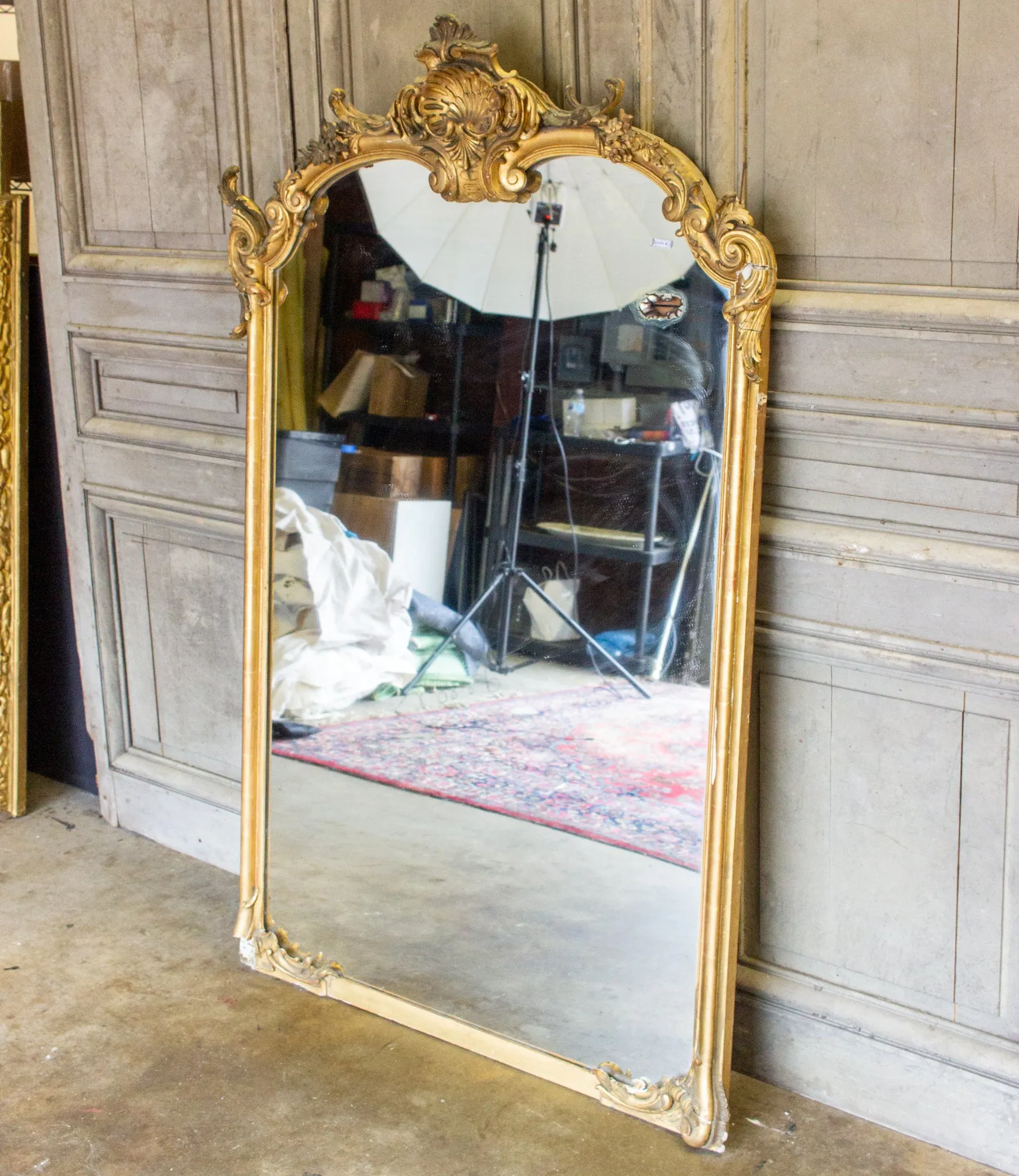 Antique Gilt Full-Length Mirror with Decorative Carvings and Shell Cartouche