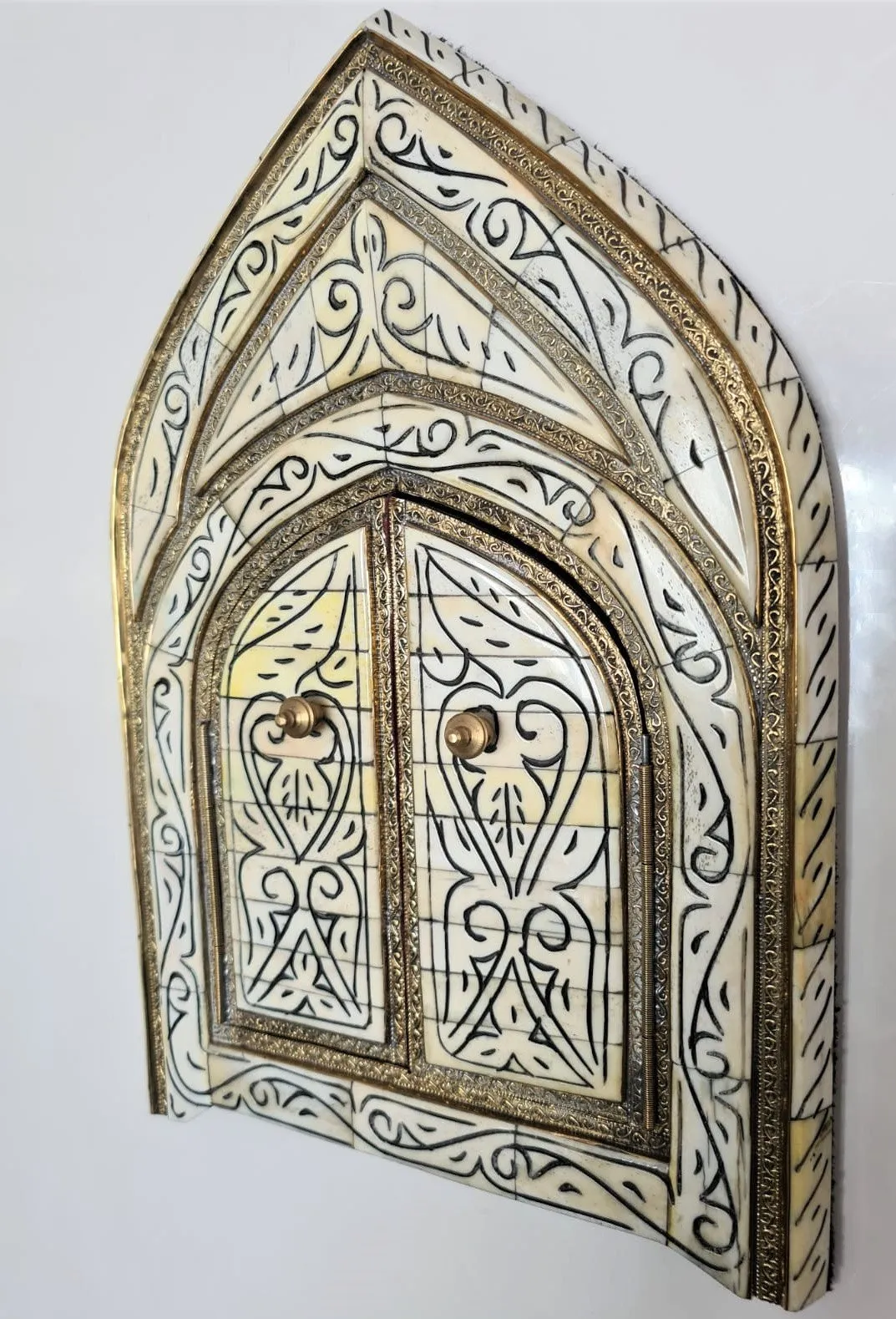 Exquisite brass and bone mirror