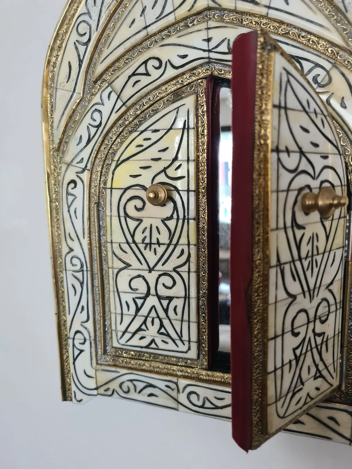 Exquisite brass and bone mirror