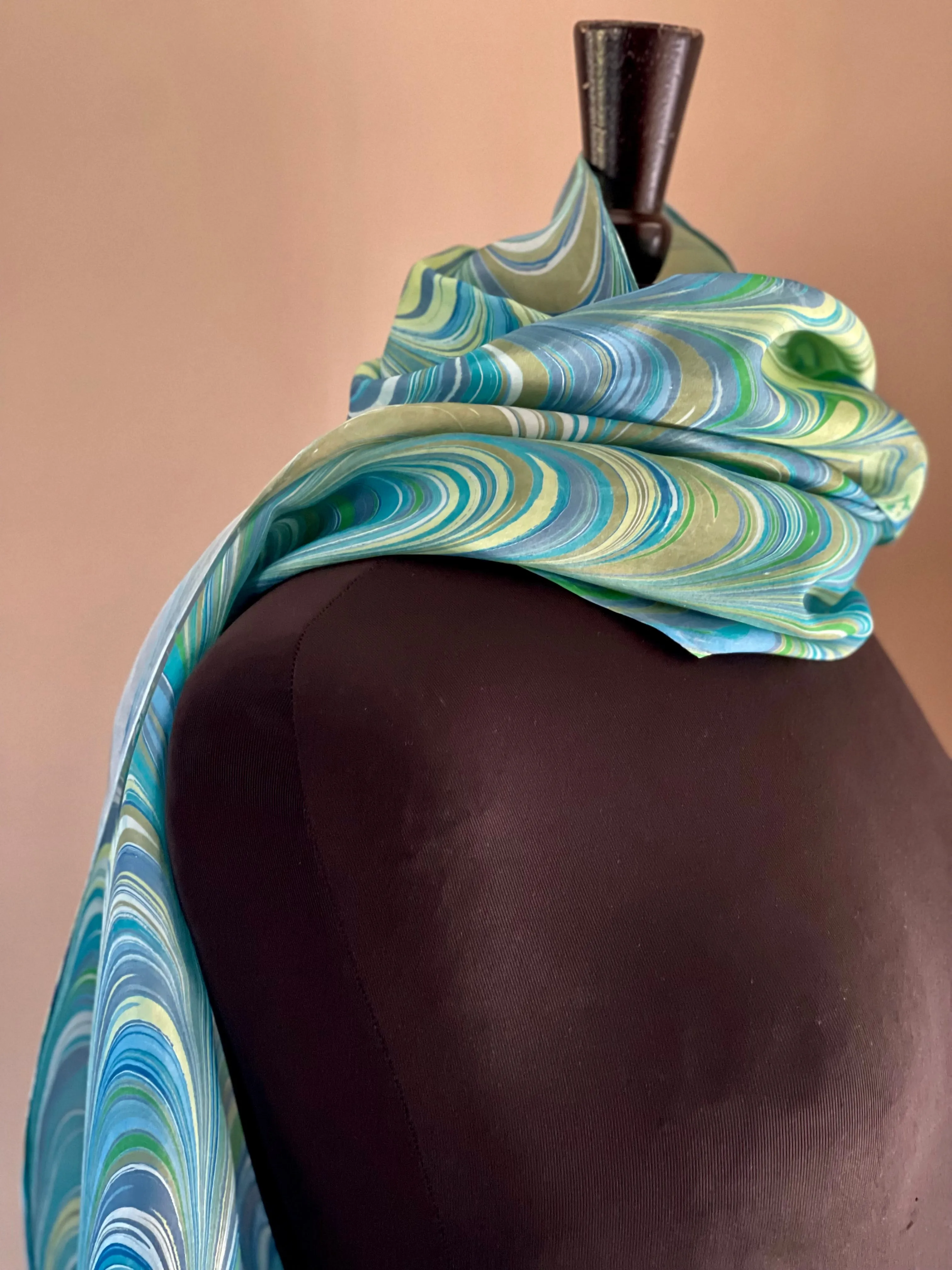Stripes of blue green yellow water marbled 8mm Habotai silk.  Hang on the wall, use as a table runner or wear this unique piece