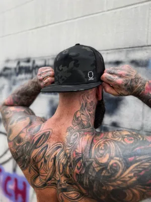 TDC SYMBOL BLACK CAMO FLAT BILL HAT